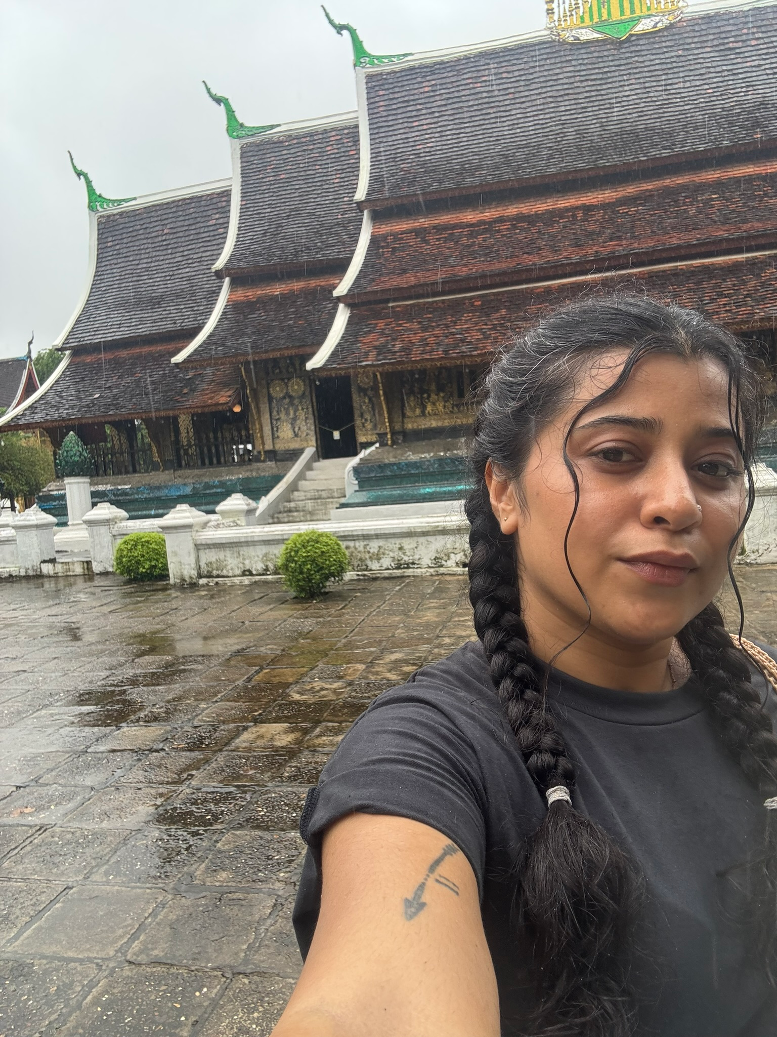 Solo travel Luang Prabang: a woman at a temple