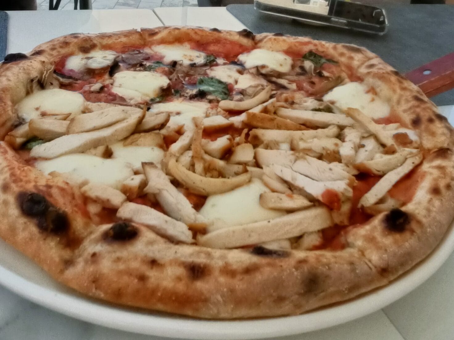 Wood-fired pizza at a Giotto Italian Restaurant in Bukhara Old City